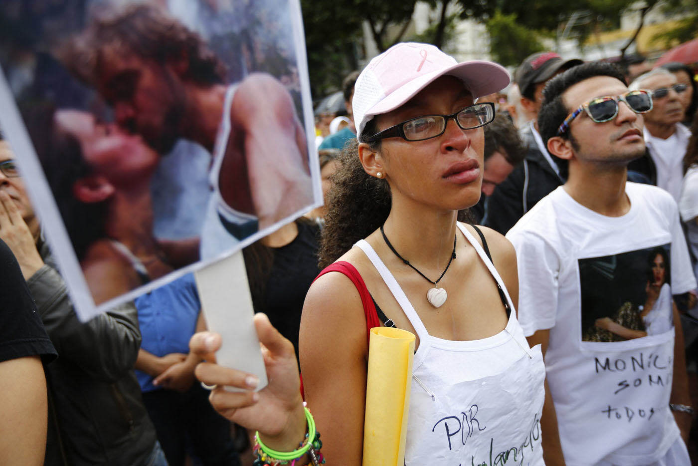 Fan of former Miss Venezuela Monica Spear reacts while taking part in a demonstration against violence in Caracas