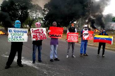 ¡LO ÚLTIMO! Trancada Autopista del Este en Valencia por protesta de encapuchados (+Fotos)