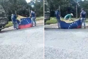 ¡SIN PENA! Captan a individuos recogiendo desperdicios con la bandera nacional (+Video)