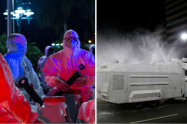 ¡MÍRELOS! Los hombres con trajes de blanco que desinfectan las calles de Caracas al caer la noche (+Fotos)